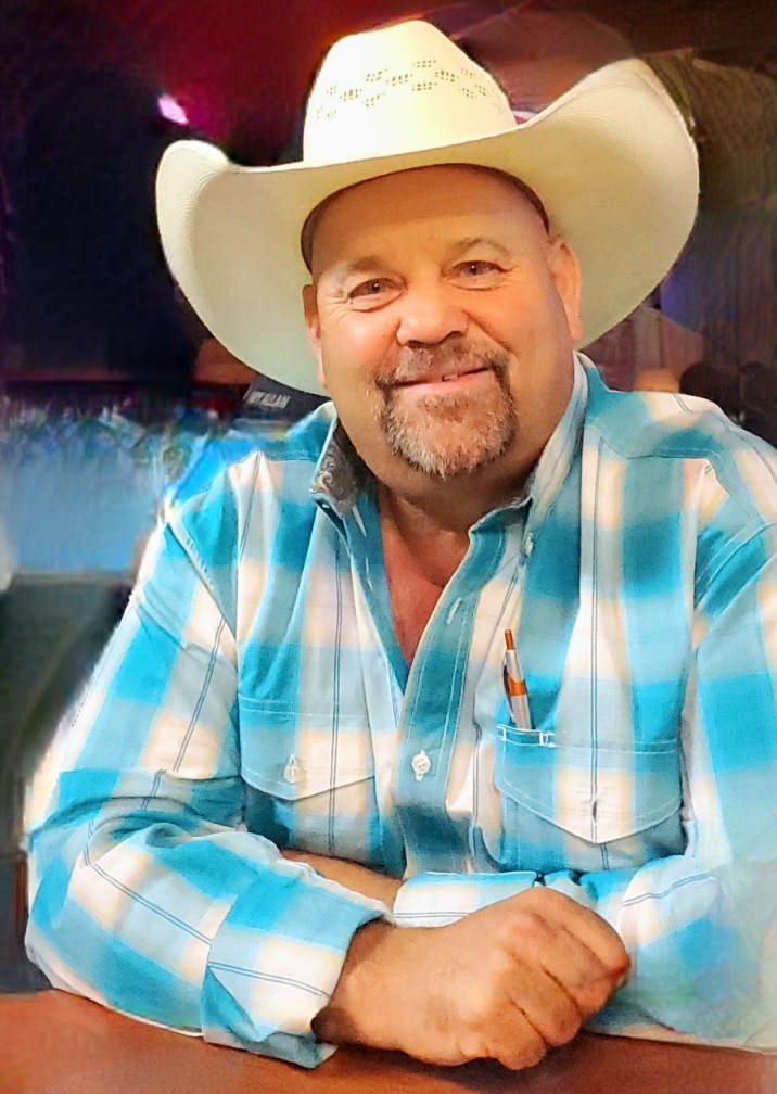 Shane Swett, Republican candidate for Wyoming State Representative District 13, wearing a white cowboy hat and teal plaid shirt
